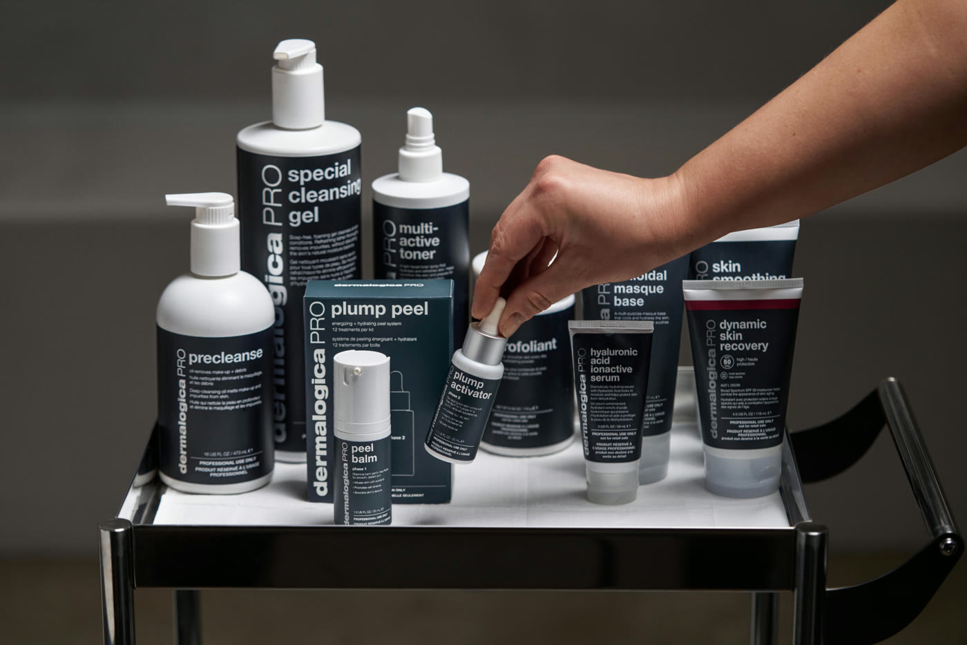 Dermalogica PRO professional skin care products arranged on a treatment trolley
